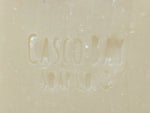 close up of a creamy white bar of soap