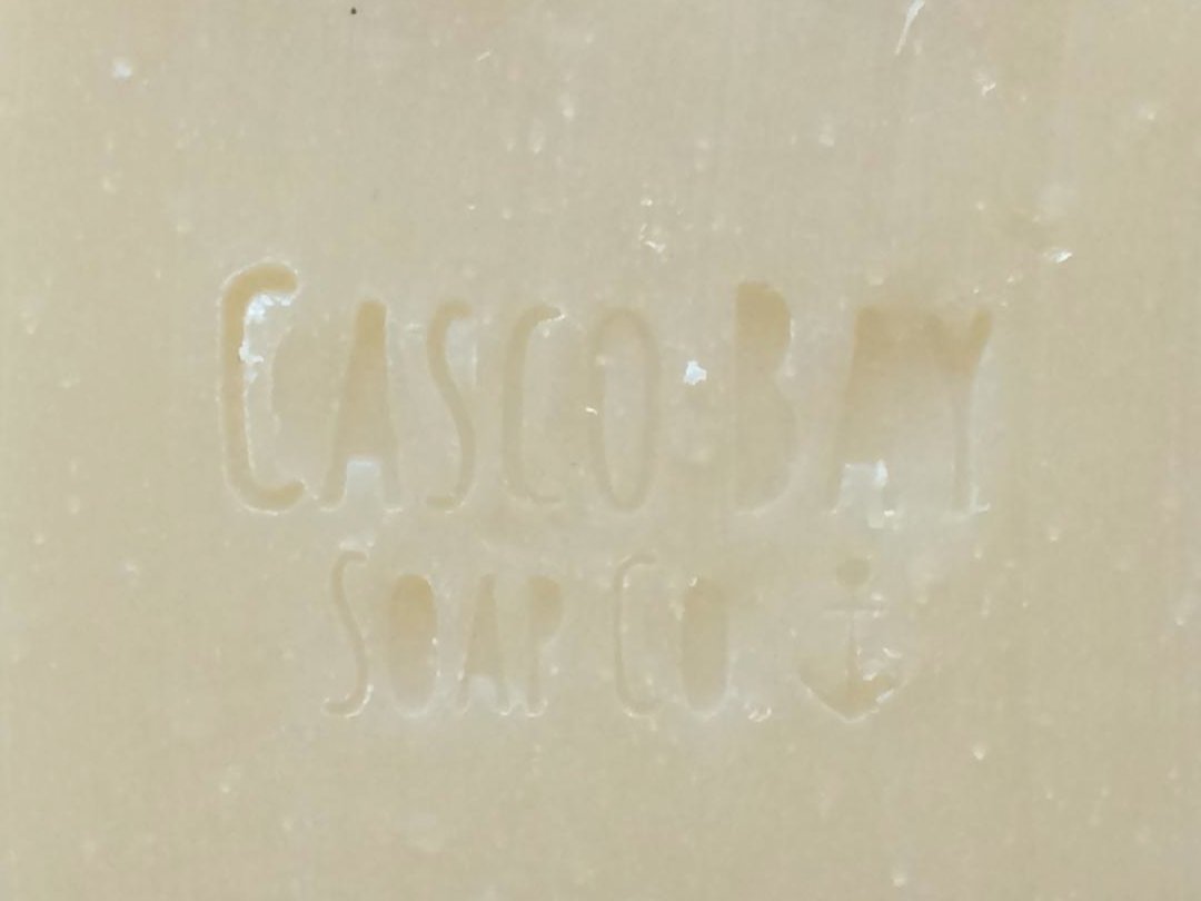 close up of a creamy white bar of soap