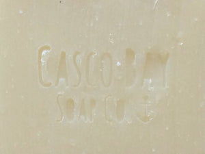 close up of a creamy white bar of soap