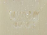 close up of a creamy white bar of soap