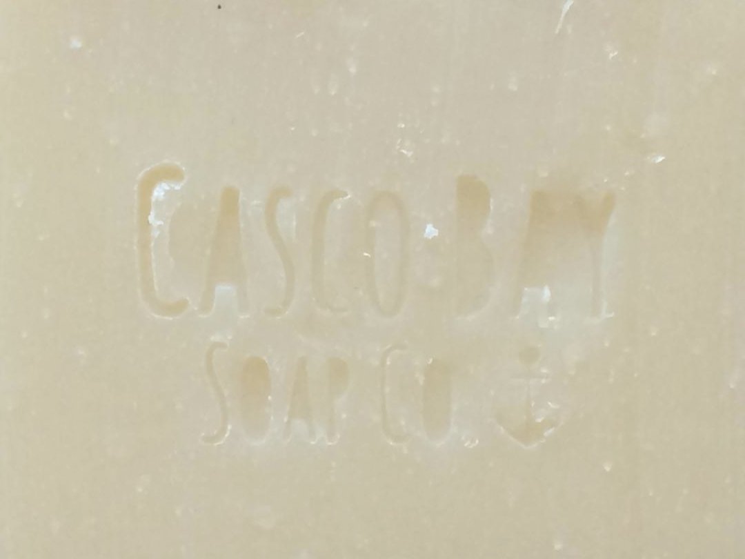 close up of a creamy white bar of soap